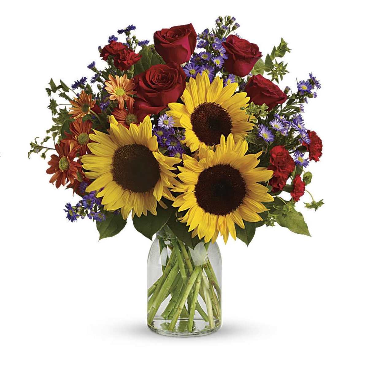 Bouquet of sunflowers, red roses, and purple daisies in a glass vase