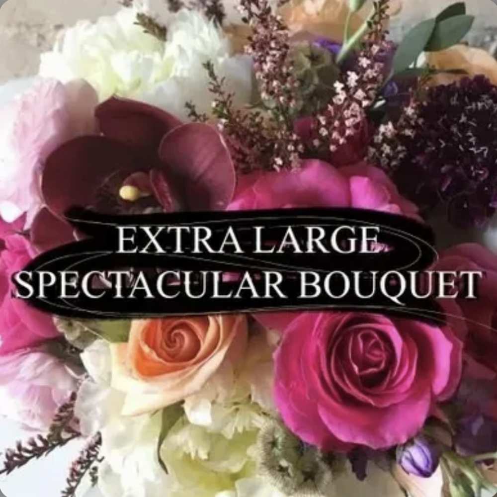 Large bouquet of pink, white, and peach flowers