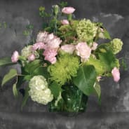 Pink roses and green chrysanthemums in a green vase