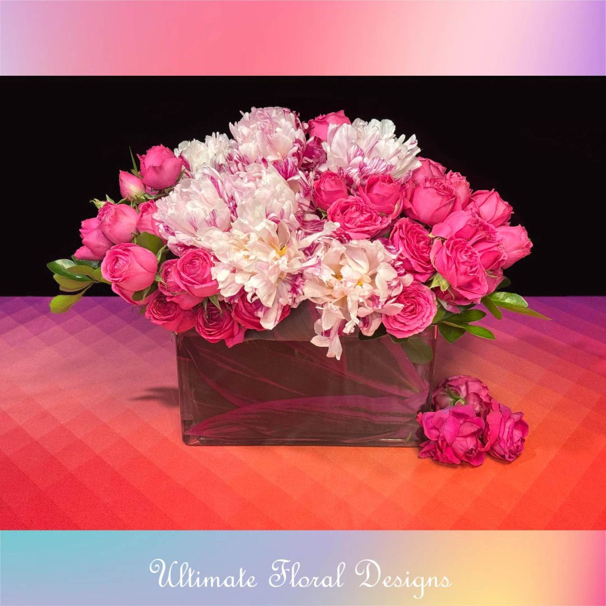 Pink and white bouquet in a rectangular glass vase