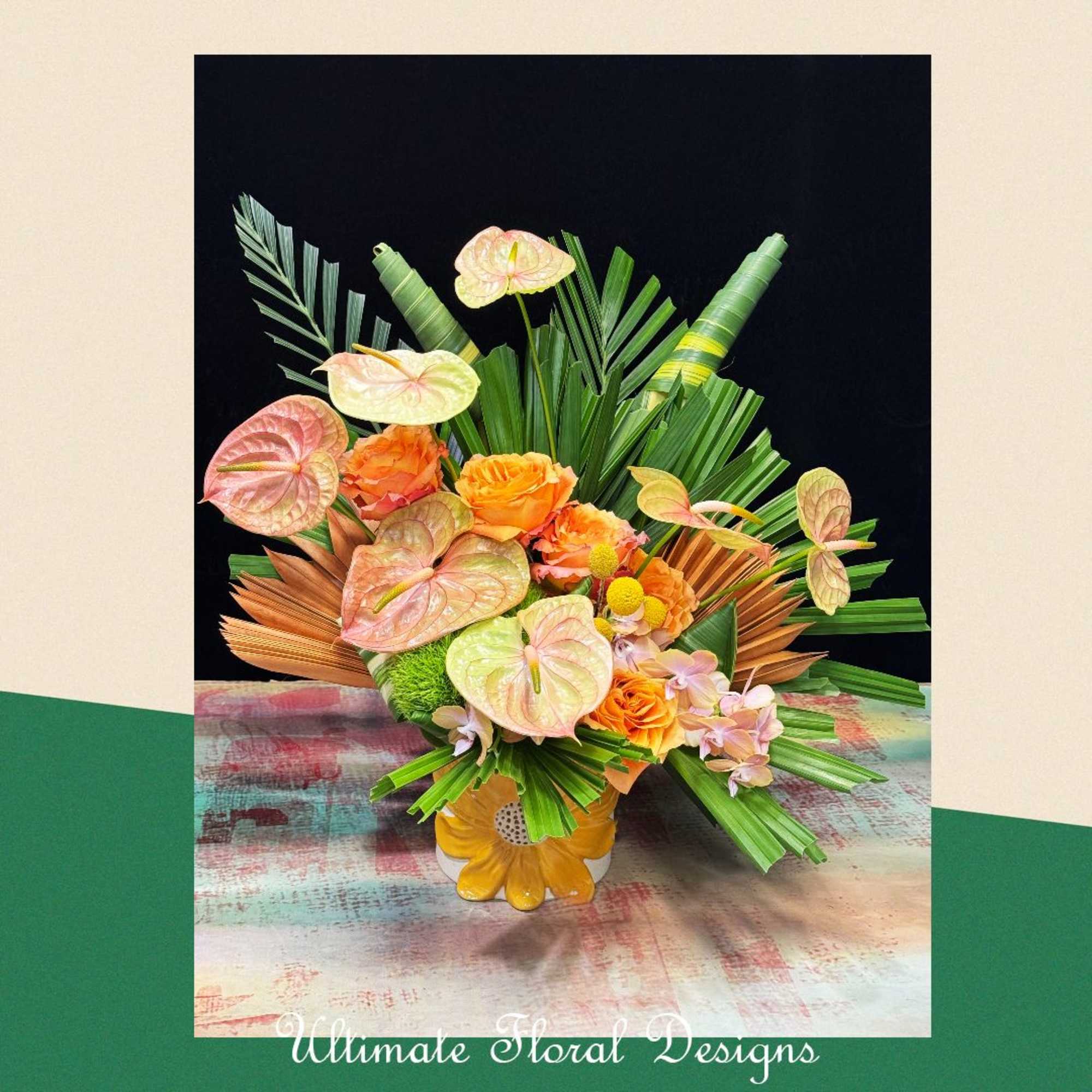 Tropical floral arrangement with orange roses and anthuriums in a yellow vase