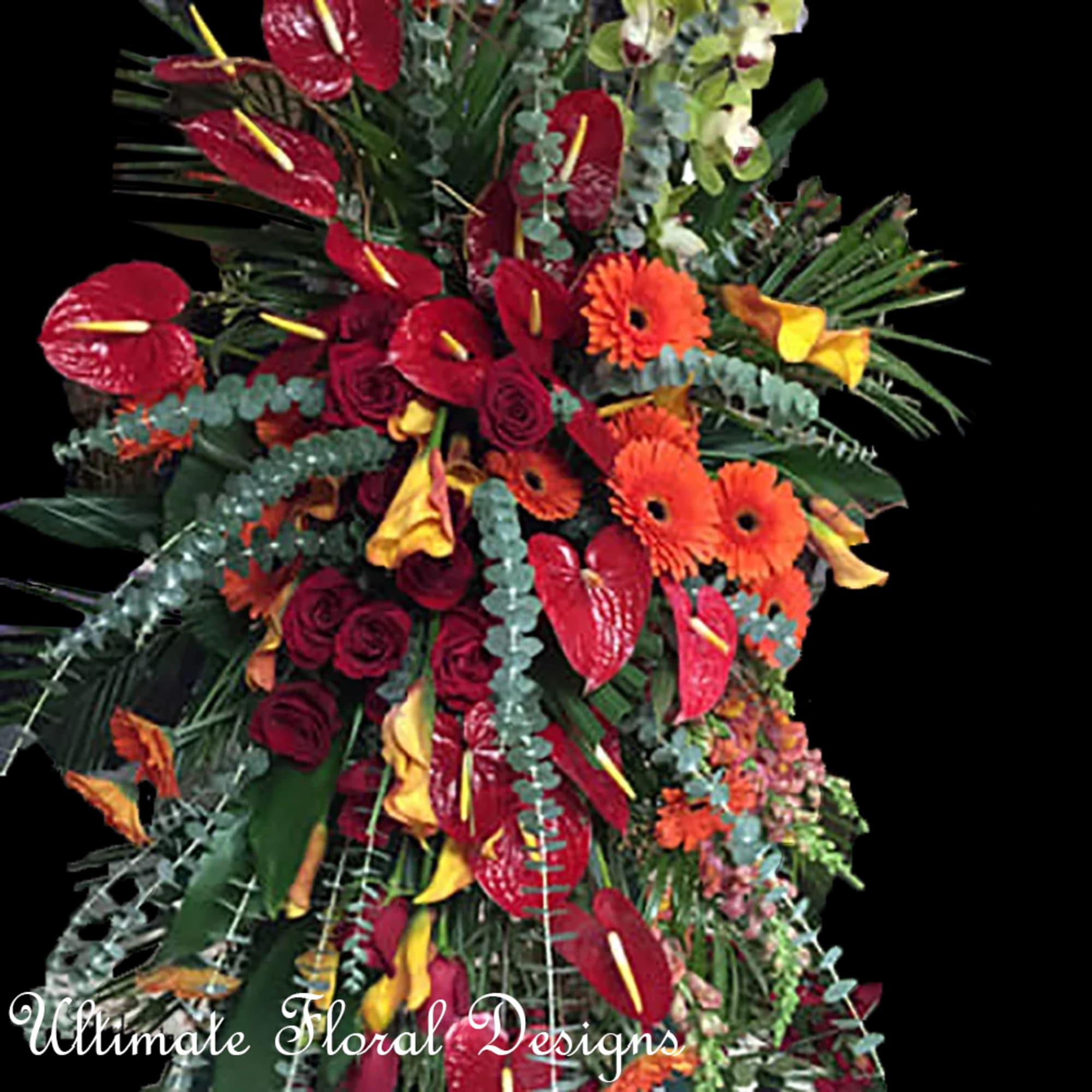 Large tropical floral arrangement with red anthuriums and orange gerbera daisies