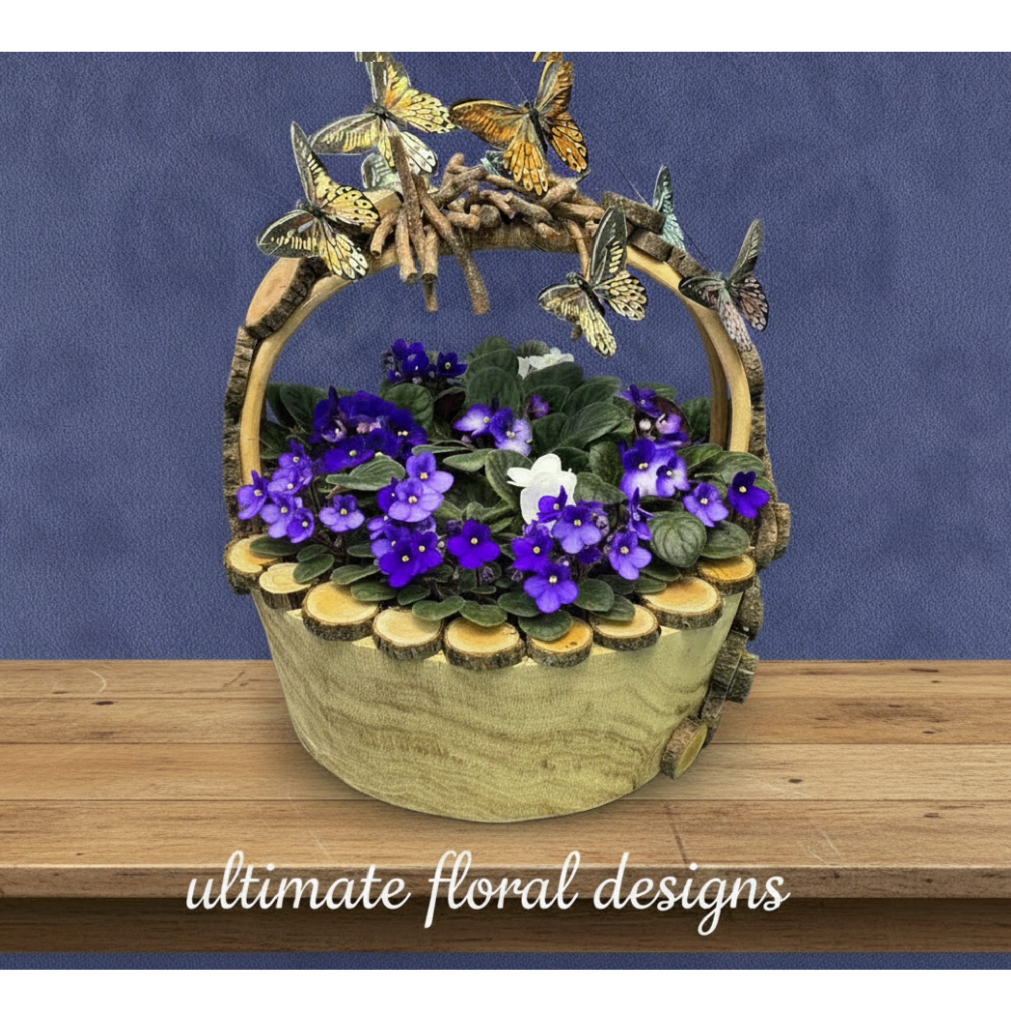 Basket arrangement of purple and white violets with butterfly decorations