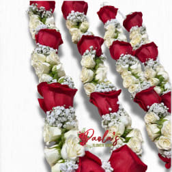 Red and white rose garlands with baby's breath on a white background