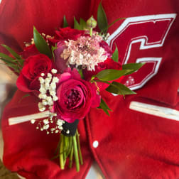 Red rose bouquet with pink and white filler flowers
