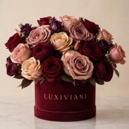 Bouquet of roses in a burgundy velvet box