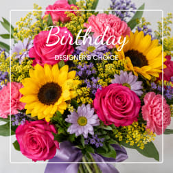 Bright mixed bouquet with roses, sunflowers, carnations, and daisies