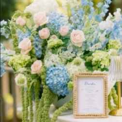 Pastel floral arrangement with blue and pink blooms in a vase