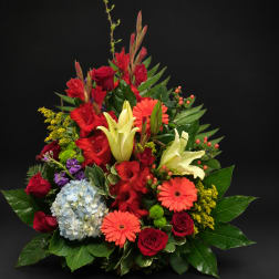Mixed bouquet with red roses, lilies, gerbera daisies, and hydrangea
