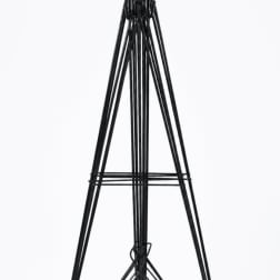 Black metal easel stand on a white background