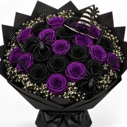 Black and purple rose bouquet with Halloween decorations and a striped witch hat