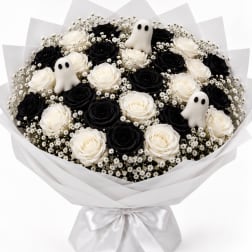 Bouquet of black and white roses with small ghost decorations