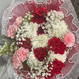 Bouquet of red, white, and pink carnations with baby's breath
