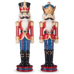 Two decorative nutcracker figurines in red, blue, and gold