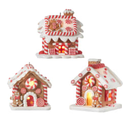 Three gingerbread house ornaments decorated with red and white candy stripes