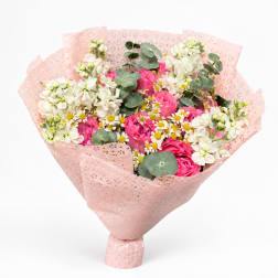 Pink and white mixed bouquet wrapped in pale pink paper