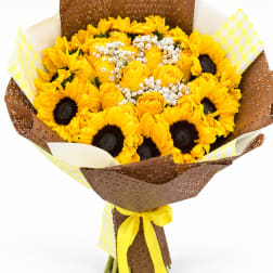 Yellow sunflower and rose bouquet wrapped in brown and checkered paper