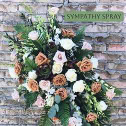 Sympathy spray with roses and orchids in soft neutral tones