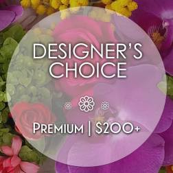 Designer’s choice floral arrangement with pink and purple blooms