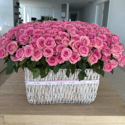 Large basket arrangement of pink roses