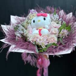 Pink rose bouquet with a Hello Kitty plush in the center