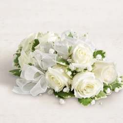 White rose bouquet with baby's breath and a sheer ribbon bow