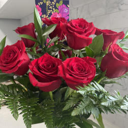 Bouquet of red roses in a glass vase