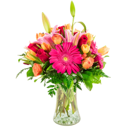Bright mixed bouquet in a clear glass vase