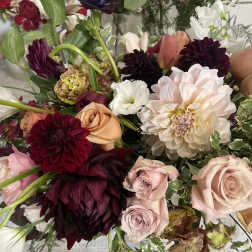 Mixed bouquet of roses, dahlias, and white blooms in pink, burgundy, and cream