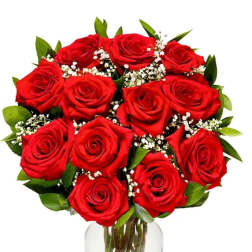 Bouquet of red roses with baby's breath in a clear glass vase