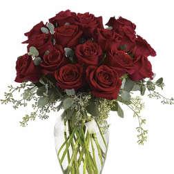 Bouquet of red roses in a clear glass vase