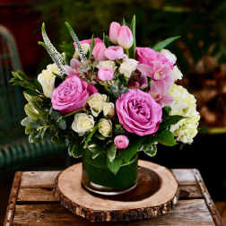 Pink and white flower arrangement in a glass vase