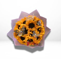 Bouquet of yellow sunflowers with butterfly picks and a birthday topper