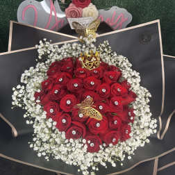 Red rose bouquet with white baby's breath and butterfly accents