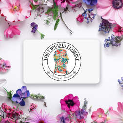 Floral logo card surrounded by assorted pink, purple, and white flowers