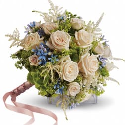 Cream rose bouquet with blue accents and pink ribbon