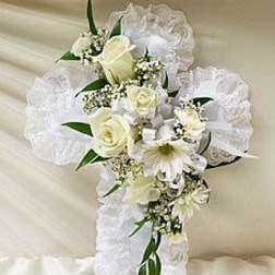 White floral cross with lace ribbon and roses