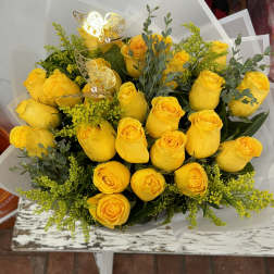 Bouquet of yellow roses with greenery and butterfly picks
