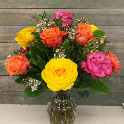 Colorful rose bouquet in a clear glass vase