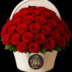 Basket of red roses with a white handle