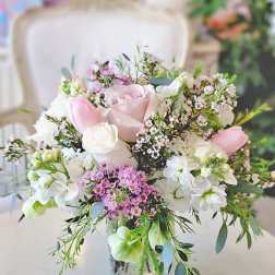 Pink and white bouquet in a clear glass vase