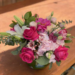 Pink and white mixed bouquet in a green vase