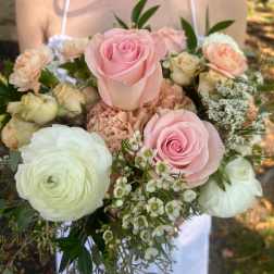 Bridal bouquet of pink and white roses with mixed blooms