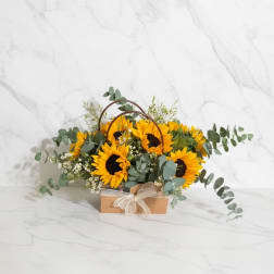Sunflower arrangement in a kraft box with a ribbon