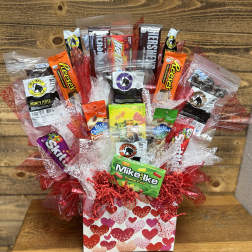 Gift basket of assorted candy and jerky in a heart-patterned box