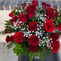 Bouquet of red roses with white baby's breath and greenery