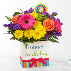 Colorful mixed flower bouquet in a birthday gift box