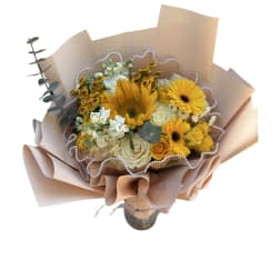 Yellow bouquet with beige paper