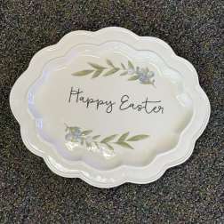 White scalloped plate with "Happy Easter" text and berry sprigs