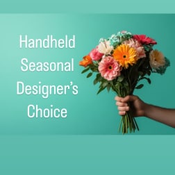 Handheld bouquet of mixed colorful flowers